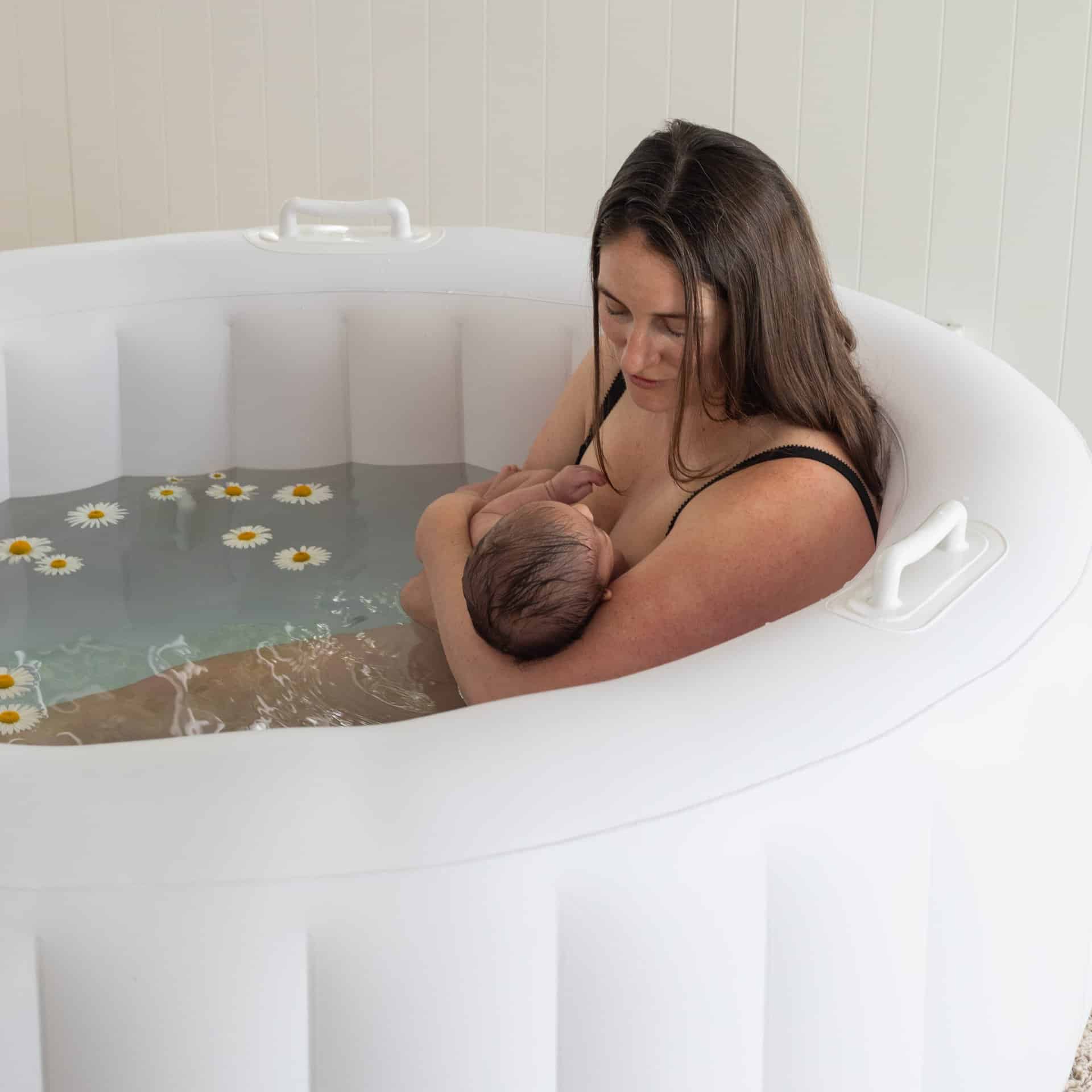 Bloom Birth Pool - close up of woman with child in birth pool